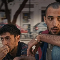 Two men sitting together