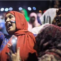 Woman shouting in a crowd